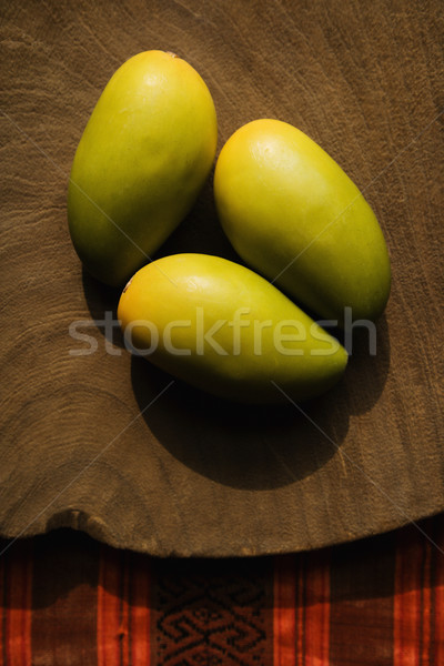 Three wooden mangoes. Stock photo © iofoto