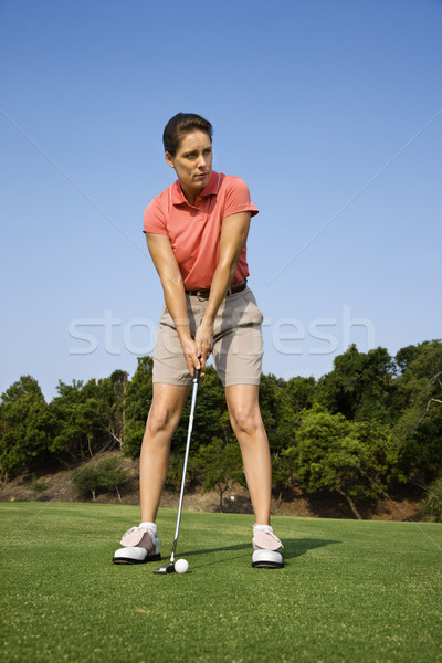 Woman putting golf ball. Stock photo © iofoto