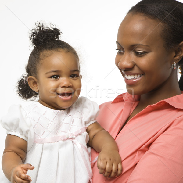 Nő tart csecsemő lány afroamerikai áll Stock fotó © iofoto