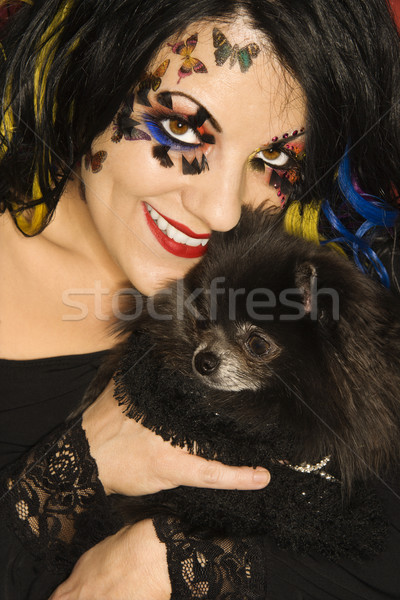 Woman holding Pomeranian dog. Stock photo © iofoto