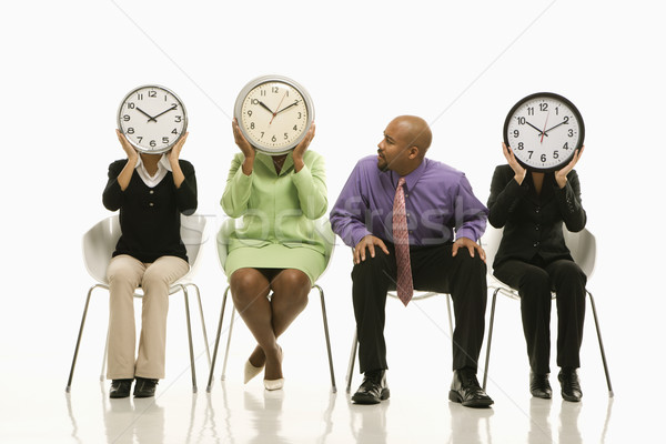 Clocks over faces. Stock photo © iofoto