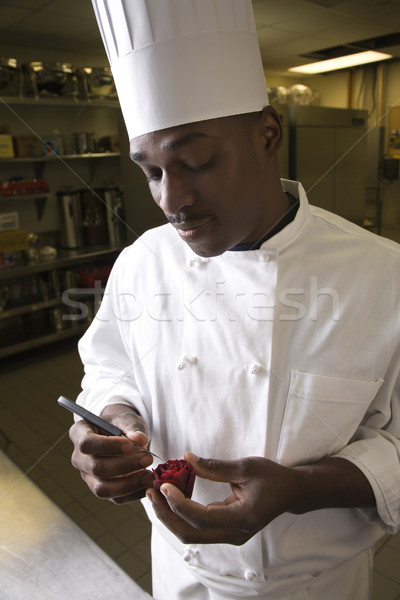 Chef carving beet. Stock photo © iofoto