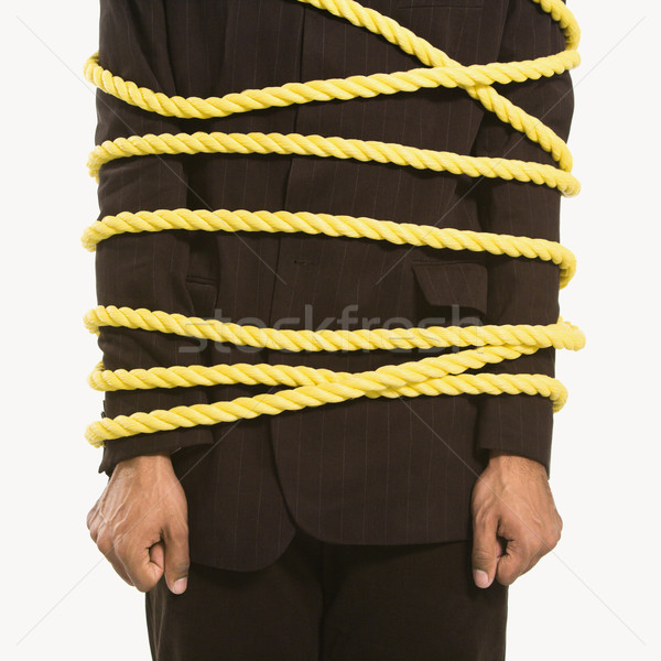 Businessman tied in rope. Stock photo © iofoto