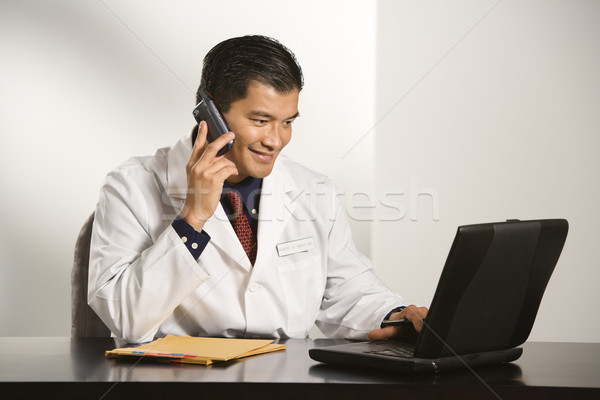 Médecin bureau asian médecin de sexe masculin séance [[stock_photo]] © iofoto
