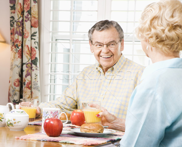 Mature couple eating breakfast. Stock photo © iofoto