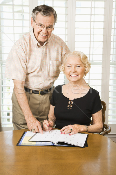 Mature woman with calendar. Stock photo © iofoto