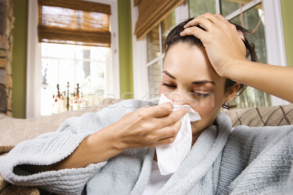 Malade jeune femme moucher malade nez Photo stock © iofoto