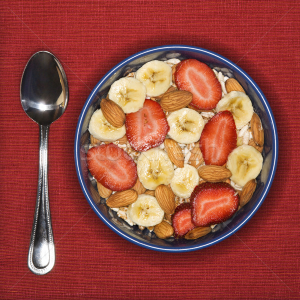 Frühstück Schüssel Löffel Bananen Erdbeeren Mandeln Stock foto © iofoto