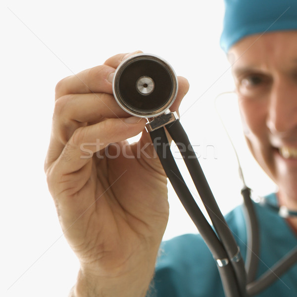 Orvos tart sztetoszkóp kaukázusi férfi orvos cserjék Stock fotó © iofoto