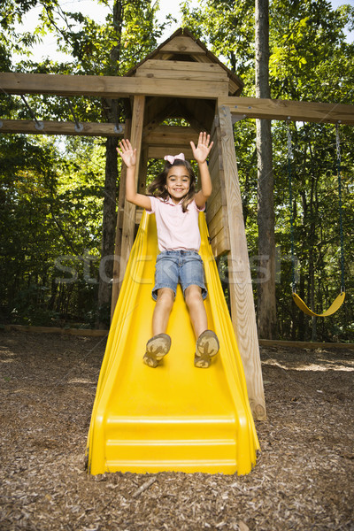 Gelukkig meisje latino meisje beneden outdoor slide Stockfoto © iofoto