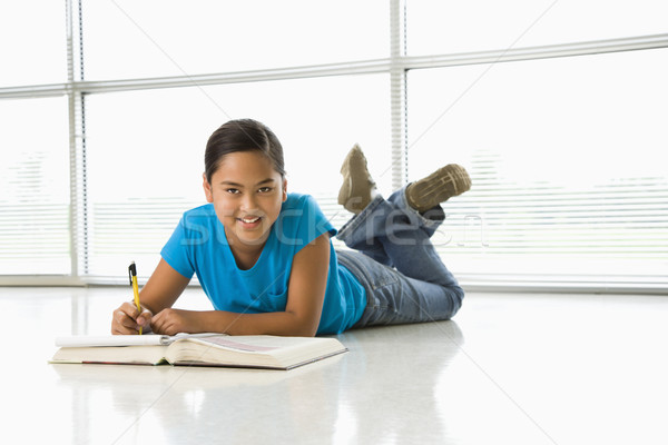 Girl doing homework. Stock photo © iofoto