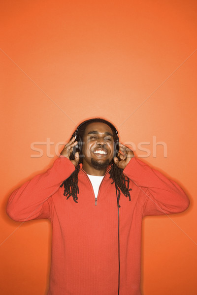 Stock photo: Man listening to headphones.