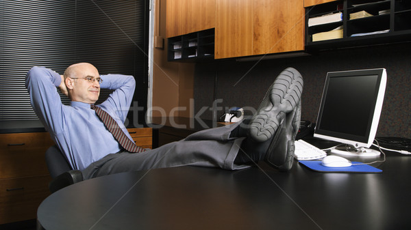 üzletember mobiltelefon kaukázusi középkorú iroda ül Stock fotó © iofoto