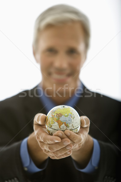 Geschäftsmann halten Welt selektiven Fokus Stock foto © iofoto