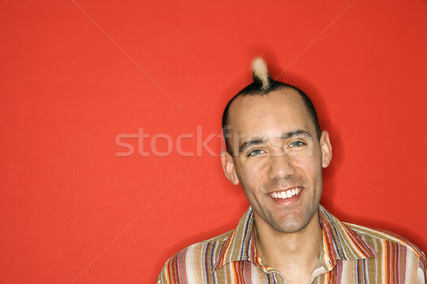 Smiling man with mohawk. Stock photo © iofoto