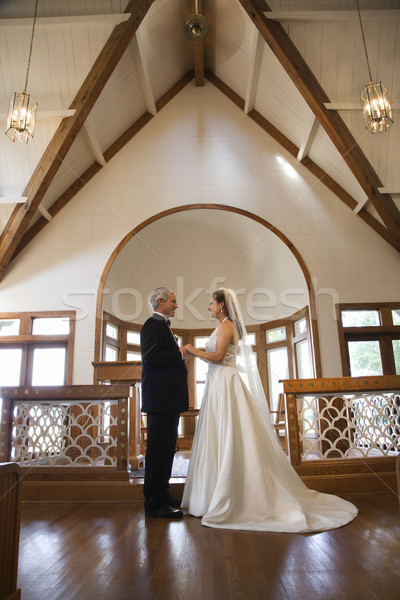 Templom esküvő menyasszony vőlegény kéz a kézben férfi Stock fotó © iofoto