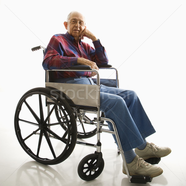 Elderly man in wheelchair. Stock photo © iofoto