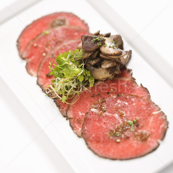 Beef carpaccio with mushrooms. Stock photo © iofoto