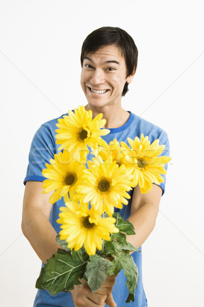 Uśmiechnięty człowiek bukiet asian młody człowiek Zdjęcia stock © iofoto