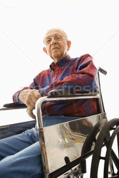 Elderly man in wheelchair. Stock photo © iofoto