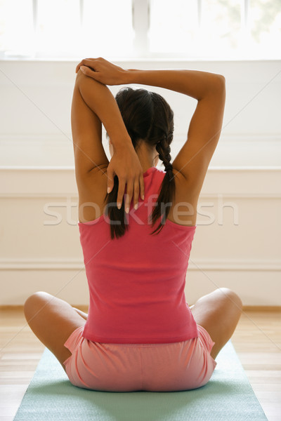 вид сзади сидят скрещенными ногами женщину Сток-фото © iofoto