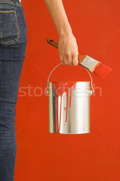 Woman holding paint can. Stock photo © iofoto