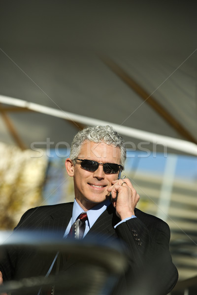 Businessman with cellphone. Stock photo © iofoto