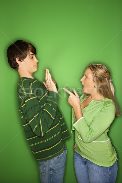 Teen boy and girl fighting. Stock photo © iofoto