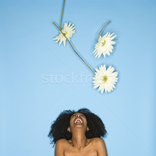 Woman with flowers iin air. Stock photo © iofoto