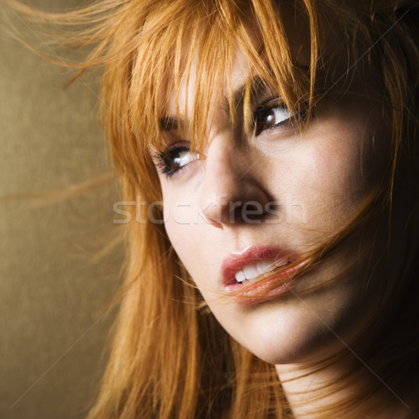 Windblown woman looking to side Stock photo © iofoto