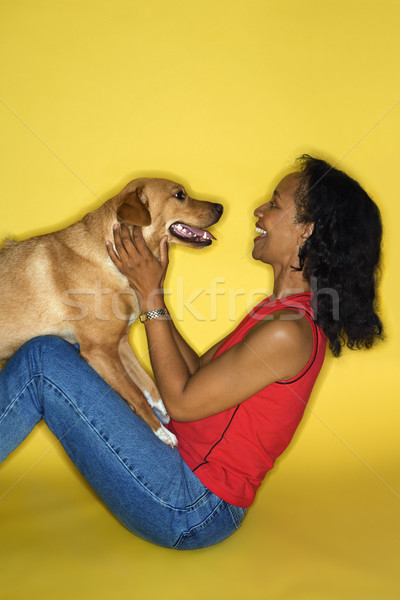 Donna giocare cane african american adulto femminile Foto d'archivio © iofoto