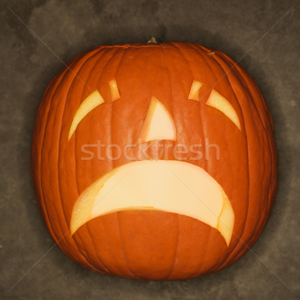 Sad carved pumpkin. Stock photo © iofoto
