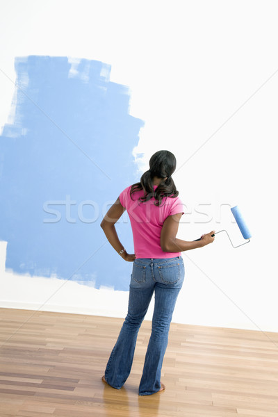 Woman observing paint job. Stock photo © iofoto