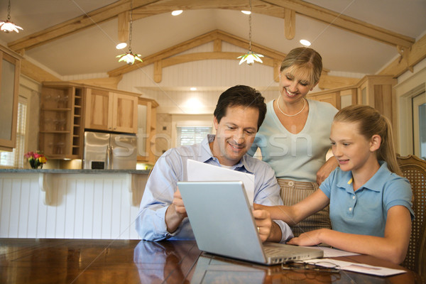 Family paying bills on computer. Stock photo © iofoto