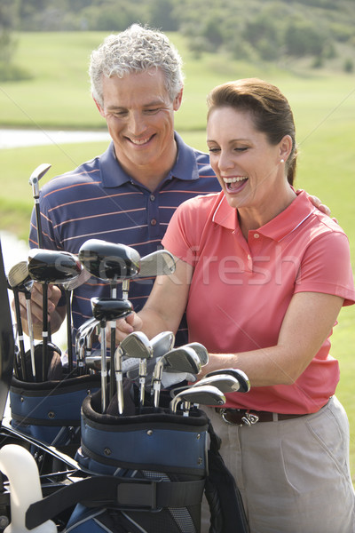 Coppia giocare golf uomo donna sorridente Foto d'archivio © iofoto