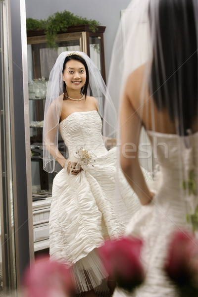 Bride admiring dress.  Stock photo © iofoto