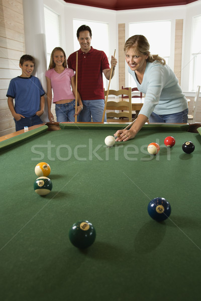 Family Playing Pool in Rec Room Stock photo © iofoto