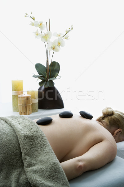 Hot stone massage. Stock photo © iofoto