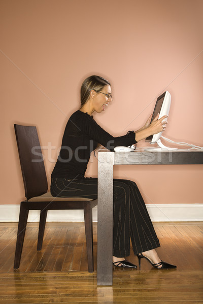 Attractive Young Businesswoman Looking at Computer Surprised Stock photo © iofoto