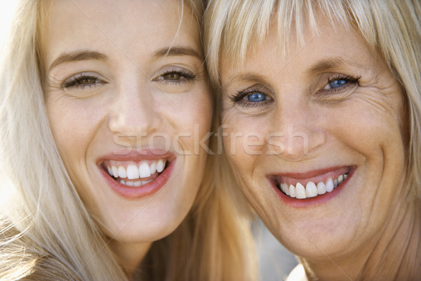 Mom and daughter smiling. Stock photo © iofoto