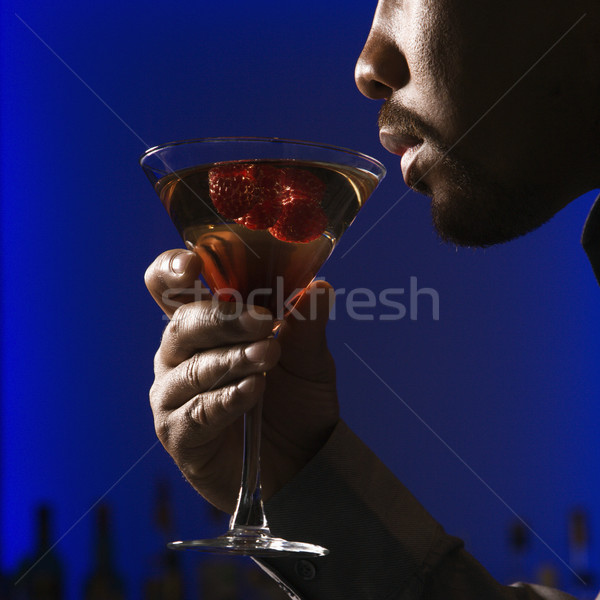 Man drinking martini. Stock photo © iofoto
