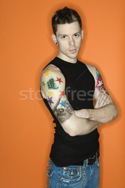 Homem tatuagens caucasiano masculino laranja Foto stock © iofoto