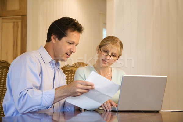 Husband and wife paying bills. Stock photo © iofoto