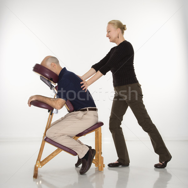 Woman massaging man. Stock photo © iofoto
