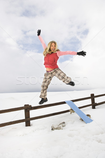 Woman jumping happily. Stock photo © iofoto