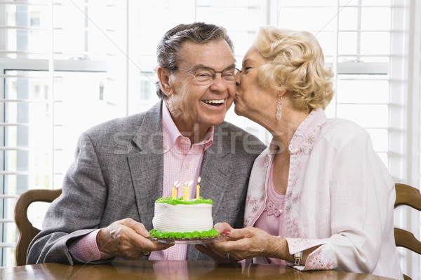 Mature couple with cake. Stock photo © iofoto