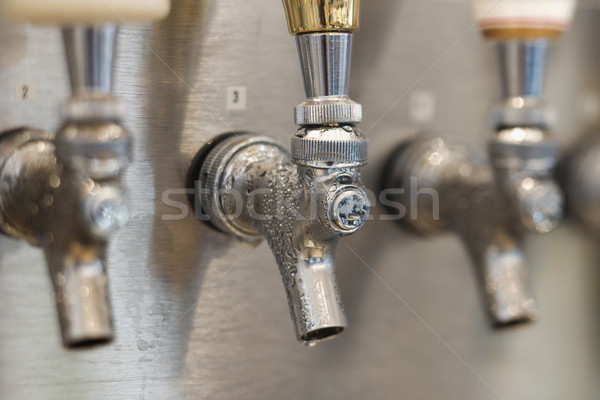 Trio of Beer Tap Spouts Stock photo © iofoto