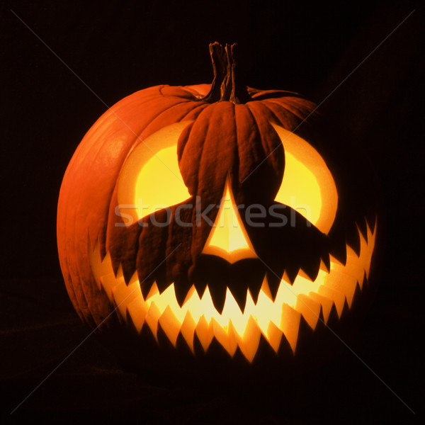 Glowing jack-o'-lantern. Stock photo © iofoto