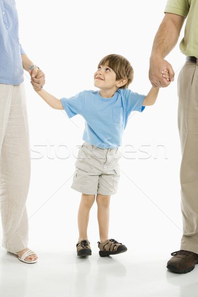 Chłopca rodziców trzymając się za ręce stałego biały rodziny Zdjęcia stock © iofoto