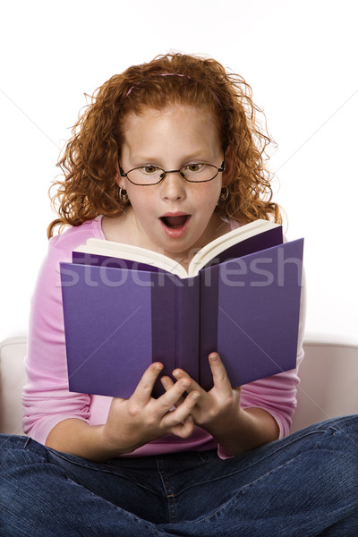 Lány olvas könyv néz meglepődött kaukázusi Stock fotó © iofoto